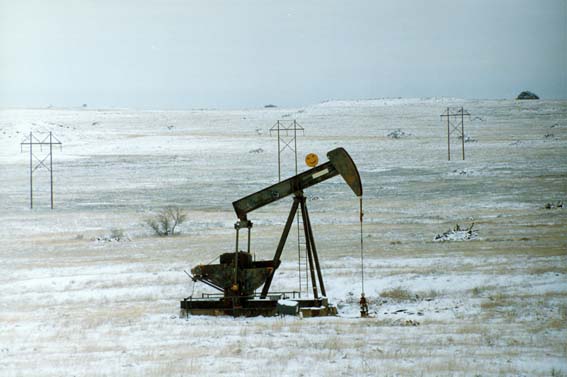 Oil pump in snowy field at McKnight Ranch
